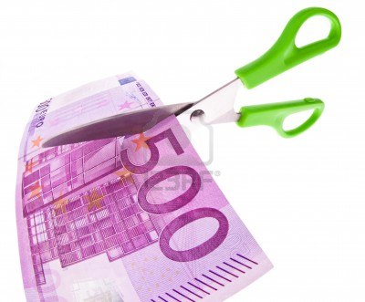 8408218-from-a-euro-bill-is-cut-with-scissors-a-piece-symbol-taxes-and-fees.jpg