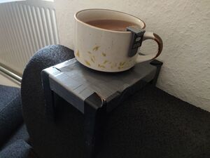 Photo of a mug with a Teambreaker attached to it