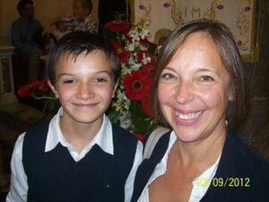 A photo of Tommi and their godmother Marina during their confirmation celebration.