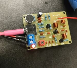 A picture of a soldered-together, PCB-based FM radio transmitter